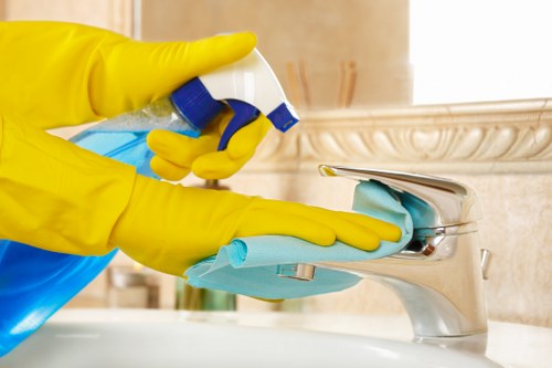Carpet cleaner preparing safe cleaning equipment in a Golders Green property